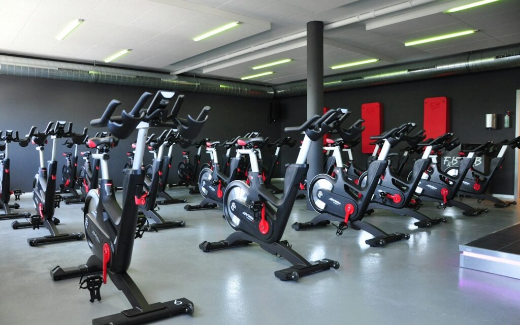 Exercise Bikes: A Complete Guide to Indoor Cycling Row of stationary exercise bikes in a gym